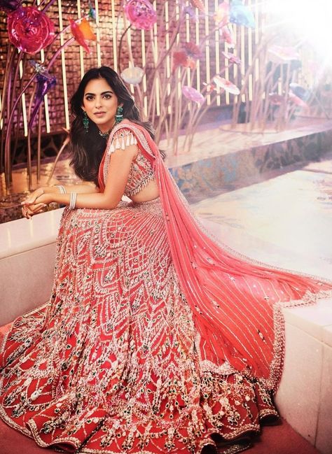 For her performance at the sangeet, she wore a coral Falguni and Shane Peacock lehenga. Bangladeshi Dress, Sangeet Lehenga, Ambani Wedding, Isha Ambani, Falguni Shane Peacock, Radhika Merchant, Anant Ambani, South Indian Bride Saree, Sangeet Ceremony