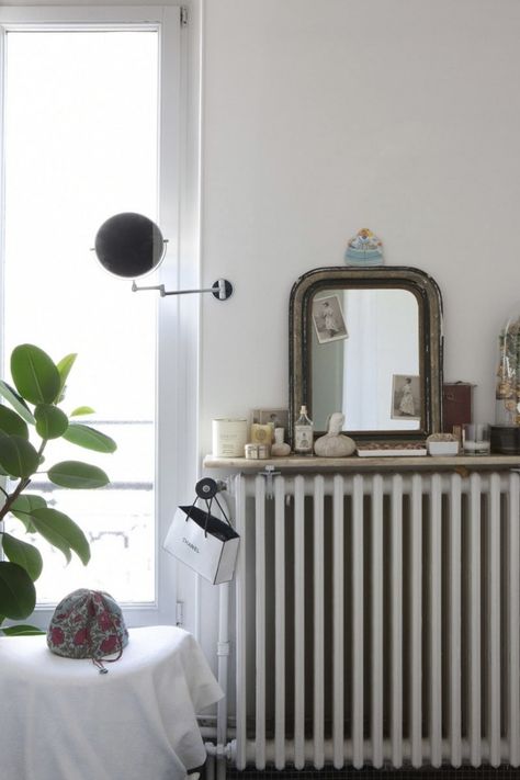 Jacky Parker Paris Apartment | Remodelista Old Radiators, Radiator Shelf, Cool Shelves, Bohemian Modern Style, Parisian Interior, Marble Shelf, Home Exchange, Custom Shelving, Bohemian Modern