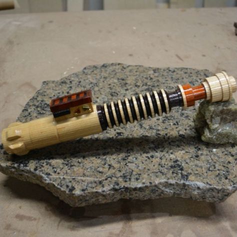 #tbt to the ROTJ Lightsaber I turned last year. Curved Hilt Lightsaber Art, Cere Junda Lightsaber, Wooden Lightsaber Hilt, Curved Lightsaber, Curved Hilt Lightsaber, Diy Lightsaber, Toy Maker, Woodworking Videos, Popular Woodworking