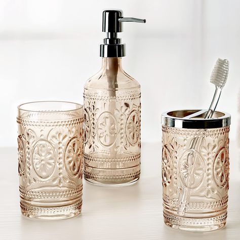 PRICES MAY VARY. Glass, Metal, Plastic The timeless charm and classic elegance of this Bath Collection makes it a perfect addition to your vintage inspired bathroom. Charming and elegant floral and beading design in romantic tinted blush pink Lotion Bottle is made of embossed tinted glass with plastic pump. Dimensions: 2.70" x 2.70" x 8.20". Holds up to 10.00 oz. of liquid soap or lotion. Toothbrush Holder is made of embossed tinted glass with metal top. Dimensions: 2.70" x 2.70" x 4.60". 2 open Floral Hedge, Vintage Inspired Bathroom, Glass Bathroom Accessories, Bathroom Tumbler, Spa Decor, Classic Bathroom, Tinted Glass, Bathroom Toothbrush Holder, Bath Accessories Set