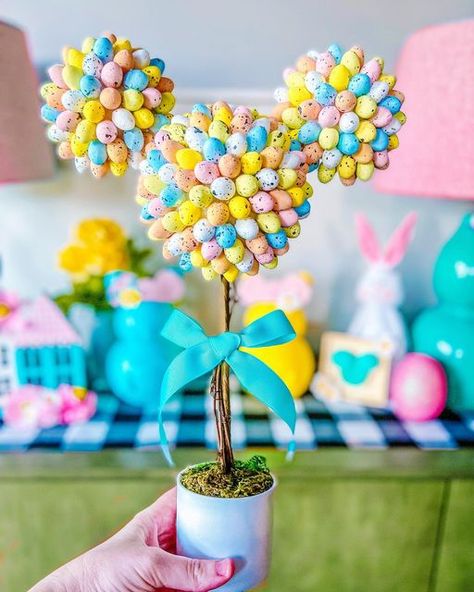 Ginny | magical family lifestyle ✨ on Instagram: "Hoppy Tuesday, friends! Here’s an EGGstra magical Mickey Mouse topiary DIY just in time for Spring 🌸 🥚🥚🥚🥚🥚🥚🥚🥚🥚🥚 I had so much fun creating this EGG Mickey topiary for my Spring shelfie! SWIPE to see alllll the shelfie goodies I DIY’ed here-when I was supposed to be cleaning my craft supplies 😂 🌸Mouse Ear bunnies 🌸Feltie Mickey sign 🌸Large floral Mickey sign 🌸Spring wooden houses 🌸Egg Mickey topiary Do you like to decorate for Spr Mickey Centerpiece, Easter Topiary, Mickey Easter, Topiary Diy, Disney Furniture, Disney Easter, Disney Home Decor, Wooden Houses, Disney Holiday