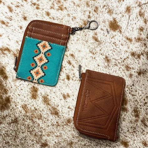 Wrangler Wallet Features A Southwestern Aztec Design That Exudes Charm And Elegance. Small Wallet Includes Three Card Slots And A Convenient Zippered Compartment. Wrangler Card Wallet Comes With A Metallic Chain And Clasp Hook. Women's Wallets Measure 10.5" X 3.5". This Credit Card Holder Will Keep Everything You Place In It Safe And Secure. Wrangler Wallet, Real Cowgirl, Country Girls Outfits, Women's Wallets, Aztec Design, Aztec Designs, Girls Outfits, Small Wallet, Credit Card Holder