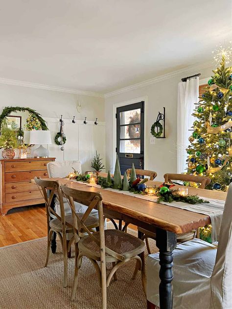 Where To Put Dining Table In Living Room, Dining In The Living Room, Green White Wood Dining Room, Dining Table In Middle Of Living Room, Front Door Enters Dining Room, Turning A Living Room Into A Dining Room, Cozy Dinning Room Decor, Enter House Into Dining Room, Entryway In Dining Room