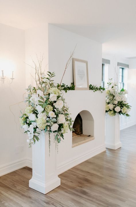 Wedding Aisle Fireplace, Greenery Altar Arrangement, Flower Stand Wedding Floral Arrangements, Altar Centerpieces Wedding, Pedestal Flower Arrangements Wedding, Wedding Flower Arrangements Altar, Diy Wedding Pillars Columns, Flower Pillars Wedding Altars, Fireplace Floral Arrangements Wedding