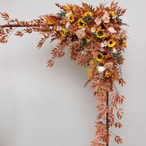 Embrace the enchanting hues of autumn with our stunning floral arrangement, perfect for adding a touch of warmth and elegance to any wedding or event. 🌻🍂 #FlowerArrangement #flowersarch #archdecor #Arches #sunflowers🌻 #sunflowerswedding #artificialflowers #fauxflowerarrangement #summerwedding #fallarch #fallwedding #weddindflorist #weddingvendor Sunflower Arch, Fallen Arches, Faux Flower Arrangements, Sunflower Wedding, Floral Arrangement, Wedding Vendors, Artificial Flowers, Fall Wedding, Summer Wedding