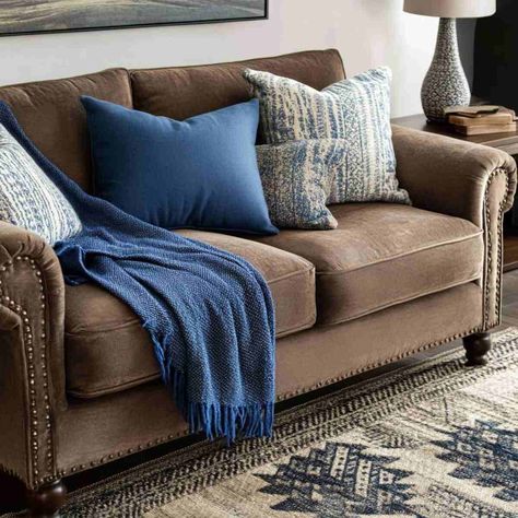 20 Stunning Brown Couch Living Room Ideas You’ll Love Blue And Brown Pillows On Couch, Tweed Couch, Brown Sectional Living Room, Brown Couch Living Room Ideas, Royal Blue Pillows, Brown Couch Decor, Brown And Blue Living Room, Leather Couch Sectional, Couch Living Room Ideas