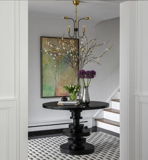 A bold black modern bistro dining table used here for a striking entryway table. The Corum table seeing here. ⁣ ⁣ Design @chezlissette ⁣ 📸 @kylejcaldwell Modern Entryway Table, Modern Bistro, Entryway Table Modern, Bistro Dining Table, The World Of Interiors, Modern Entryway, Hallway Decor, Entryway Table, Elegant Interiors