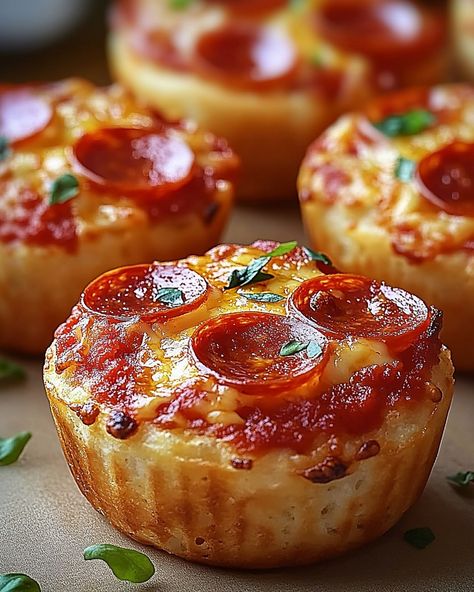 🍕 Pepperoni Pizza Muffins 🧀 Your Perfect Snack for Game Day or Family Nights! Quick, cheesy, and utterly delicious! 🍽️ Ingredients 🍽️ - 100 ml milk - 50g mini pepperoni slices - 150g all-purpose flour - 1 large egg - 100g marinara sauce - 2 tsp baking powder - 50g melted butter - 100g mozzarella cheese, shredded - Fresh basil, chopped for garnish - 1/2 tsp salt 🧑‍🍳 Directions 🧑‍🍳 1. Prepare the Batter: Start by combining the all-purpose flour, baking powder, and salt in a large mixing bo...