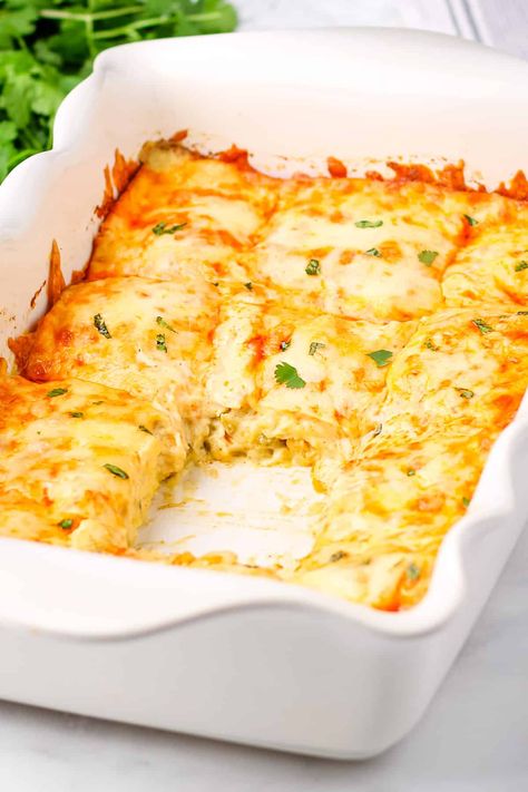 Easy Chicken Enchilada Casserole is the best comfort food! In this simple layered version of chicken enchiladas, creamy chicken is spread over corn tortillas, covered in green chile sauce, and topped with cheesy goodness! A warm, hearty meal that's quick to make and perfect for the whole family! Green Chili Chicken Enchilada Casserole, Enchiladas Creamy, Crockpot Chicken Casserole, Green Chicken Enchilada Casserole, Family Casserole, Green Chili Chicken Enchiladas, Chili Enchiladas, Easy Chicken Enchilada Casserole, Green Chile Enchilada Sauce