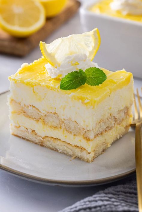 This Lemon Tiramisu is a citrusy, creamy, and delicious take on a classic Italian dessert. If you love classic tiramisu, you are going to love this recipe. Lemon Tirimasu Recipes, Lemon Teramasoo, Lemon Tiramisu With Lemon Curd, Lemon Curd Recipe Desserts, Lemonade Desserts, Lemon Mascarpone Cake, Lemon Torte, Lemon Curd Dessert, Lemon Mousse Cake