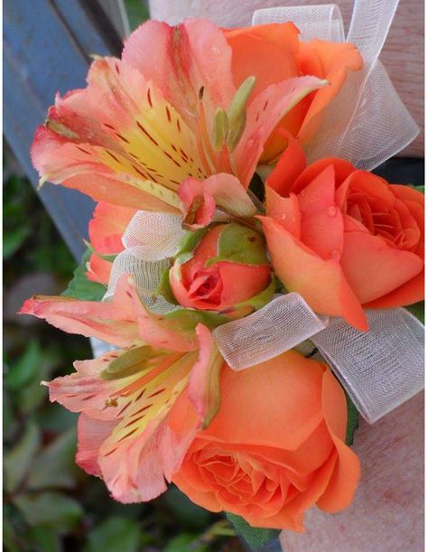 Coral roses and matching alstroemeria lilies make the perfect accent to your formal event! #casasadobes #wearableflowers Prom Flowers Orange Dress, Orange And White Corsage, Coral Corsage, Gold Corsage Prom, Coral Prom Bouquet, Orange Flower Corsage, Prom Flowers Corsage Orange, Orange Corsage, Silk Flower Corsage