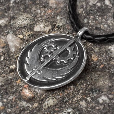 Fallout 4 Speculation Increases After Fallout Necklace Goes On Sale http://www.ubergizmo.com/2015/05/fallout-4-speculation-increases-after-fallout-necklace-goes-on-sale/ Fallout Theme, Angel Of Vengeance, Steel Aesthetic, Fallout Brotherhood Of Steel, Brotherhood Of Steel, Fallout Cosplay, Lone Wanderer, Elder Scrolls Skyrim, Bioshock Infinite