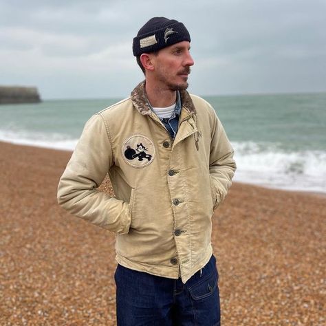 Ed Anthony Stanford on Instagram: "Taking in the sea air. Wearing a thrashed and killer faded WW2 US Navy N-1 Deck jacket from my bud @nickgbenton, with hand sewn US Navy patch representing Fighter squadron 3 (VF-3) ‘Felix the cat’ that I felt was a fitting accompaniment to this salty deck. Worn with @darte.london Patch Pocket selvedge denim pants inspired by the hard wearing utility pants worn by serviceman in WW2, factory workers, and mechanics. Also note the 1939 New York World Fair lucky to American Casual Style, Deck Jacket, World Fair, Felix The Cat, Cream Jacket, Felix The Cats, Vintage Denim Jacket, Vintage Fits, Utility Pants