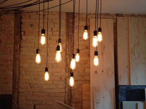 Stuck 12 light bulbs to the ceiling. Really happy about the result. #lightbulbs #edison #diningroom #brickwall #industrial Edison Lights Ceiling, Lightbulb Hanging From Ceiling, Hanging Edison Bulbs, Edison Lights Bedroom, Hanging Bulb Lights, Light Bulbs Hanging, Pillow Cube, Moodboard Cafe, Book Coffee Shop