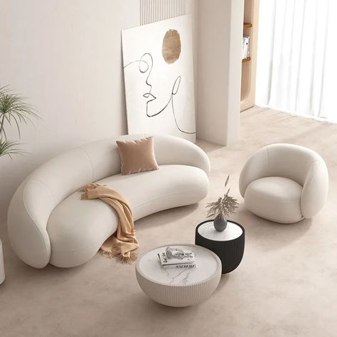 Comfort and Style All Within One Sofa! The Miles White Curved Sofa is the sofa design for your living room. It has a beautiful curved design that allows multiple people to gather and sit. Its pristine white colour adds a nice touch of elegance to any room, creating a striking focal point that invites you to unwind and relax. The upholstery offers a softness and warmth that hugs you in cosiness, making it the perfect place to relax after a long day. The sofa chair from Love Decors is not just abo Living Room Round Sofa, Curved White Couch, Curve Sofa Design, Curve Sofa Living Room, White Velvet Couch, Minimal Sofa Design, Elegant Sofa Design, White Curved Sofa, Soft Interior Design