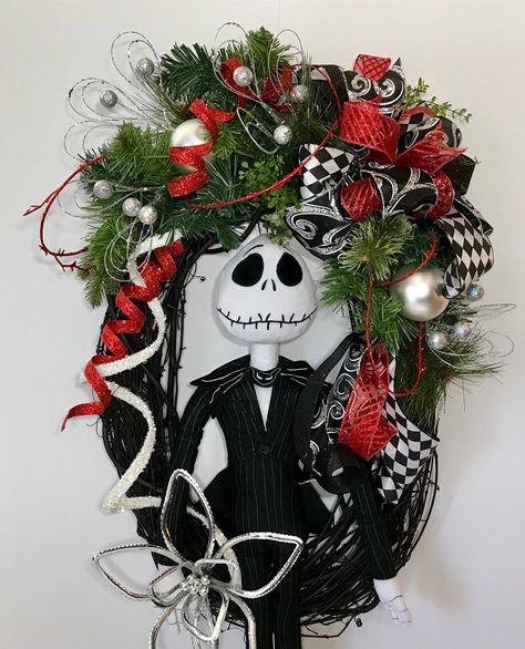 "Jack Skellington Nightmare Before Christmas Wreath, Black Oval Grapevine Jack Wreath, Front Door Xmas Halloween Wreath, Holiday Decoration Check out this awesome Jack Skellington wreath! Up for sale is a Nightmare Before Christmas black oval grapevine wreath. featuring a plush 28\" tall Jack Skellington stuffed doll. This wreath has Christmas evergreen, red and white ribbon streamers, silver ornaments, silver glitter small ornament spikes & so much more. Jack is holding a stylized, silver p Jack Skellington Wreath Diy, Jack Skellington Christmas Decorations, Nightmare Before Christmas Tree Ideas, Jack Skellington Christmas Tree, Character Wreaths, Christmas Wreath Black, Jack Skellington Wreath, Nightmare Before Christmas Wreath, Nightmare Before Christmas Tree