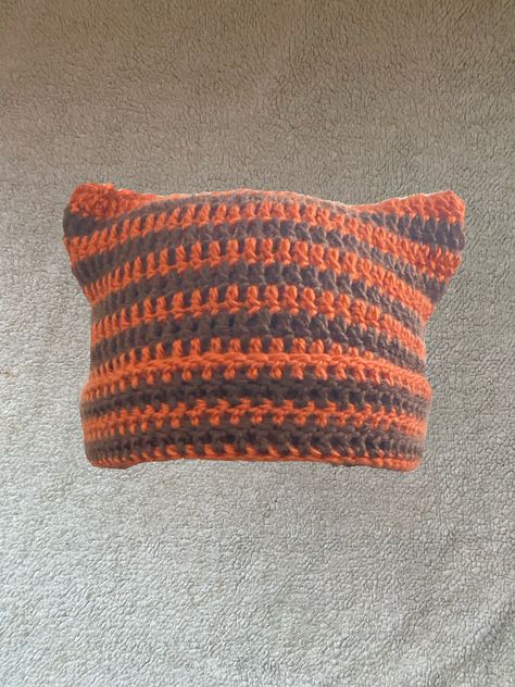 "The Orange and Brown Striped Fall Cat Beanie 🧡🤎 is meant for those who love the edgier but cute style that is both grunge and y2k! This beanie is perfect for not only to add something simple yet cute to your wardrobe but also convenient for the fast approaching colder months, simple yet so stylish for some cozy vibes! Made of 100% acrylic yarn, handmade crotched by me! FREE SHIPPING! It may take up to seven days to make, package and ship out the item! Sizing regularly is 20-22\" (in centimete Striped Cat Beanie, Brown Striped Cat, Fall Cat, Crochet Cat Hat, Fall Cats, Cat Ears Hat, Cream Cat, Fairy Festival, Cat Beanie