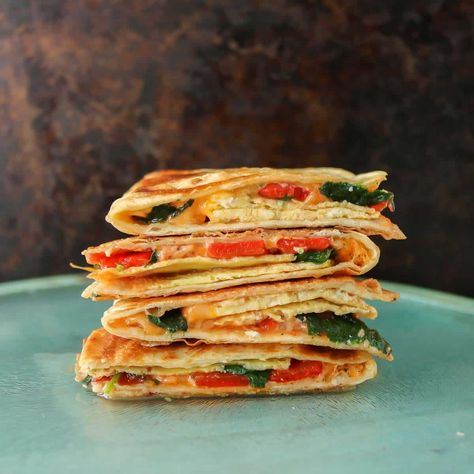 A breakfast you'll look forward to, this recipe for veggie and egg quesadillas uses simple ingredients and can be made in under 30 minutes. Egg Quesadilla, Heart Food, Weekend Breakfast, Quesadillas, Mexican Food, Simple Ingredient, Mexican Food Recipes, 30 Minutes, Gymnastics