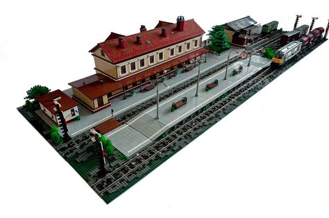 OK, here it goes. It's about 40-50% of my train station project. To be honest, the work is still in progress. The station for sure needs some life on it and at least one passenger train. It also needs some stickers here and there and tiny little details. And of course last but not least - lights :)  The main building is a modified version of my train station from Klocki Zdrój 2008. Then it was placed on 4 48x48 baseplates. It was too big and this was causing a lot of problems from mainten... Lego Train Station, Lego City Train, Lego Train Tracks, Lego Train, Lego Buildings, Lego Inspiration, Brick In The Wall, Lego Modular, Lego Trains