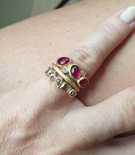 A gorgeous trio of rubies cabochons, the size of the stones are around 7x5mm, i have set them with 2 mm rose cut diamonds in the tones of cream and grays, beautifull combo, the entire ring is made of 18k yellow gold. Perfect to wear alone but can also be stack with your favorite bands. Made to order. Ruby Ring Cabochon, Red Ruby Diamond Ring, Multiple Stone Rings, Diamond Band Stack, Female Techwear, Diamond And Ruby Ring, Ethereal Jewelry, Star Ruby Ring, Stacked Diamond Bands