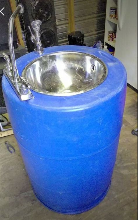 Neat idea for reusing a plastic barrel Plastic Drum Ideas Diy, Plastic Drum Ideas, Diy Metal Barrel Projects, 50 Gallon Drum Ideas, Plastic Barrel Projects, Blue Plastic Barrel Ideas, Plastic Barrel Ideas, How Do I Paint My Platic Barrel Planter, Bucket Sink