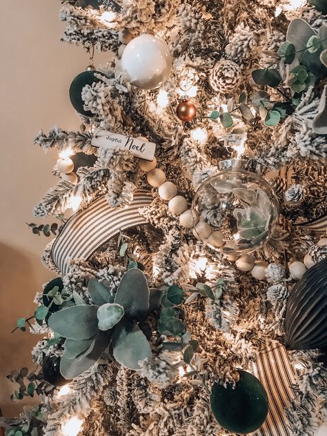 Boho Farm 2019 Christmas tree  #boho #bohemian #farmstyle #style #farm #christmas #tree #home #decor #green #plants #wood #beads #wicker #ornaments #flower #diy White Ornaments Green Christmas Tree, Christmas Tree Styles 2023, Green Boho Christmas Tree, Tan And Green Christmas Tree, Glass Dome Decor Ideas Living Room, Diy High End Ornaments, Sage Green And Black Christmas Tree, Flocked Christmas Tree With Green Decor, Boho Rustic Christmas Decor