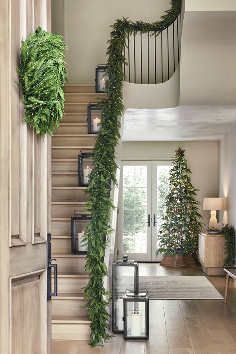 Holiday decor starts here. Shop the very best garland for all your Christmas decor ideas. Our realistic-looking faux botanicals are great for a garland on stairs, garland on mantel, garland over doorway, or anywhere else you want a green Christmas look. Stairs Decorated For Christmas, Garland Christmas Decor Stairs, Christmas Railing Decor, Stairwell Christmas Decor, Banister Garland Christmas, Garland Over Doorway, Christmas Railing Decor Indoor, Christmas Garland Stairs, Christmas Garland Doorway