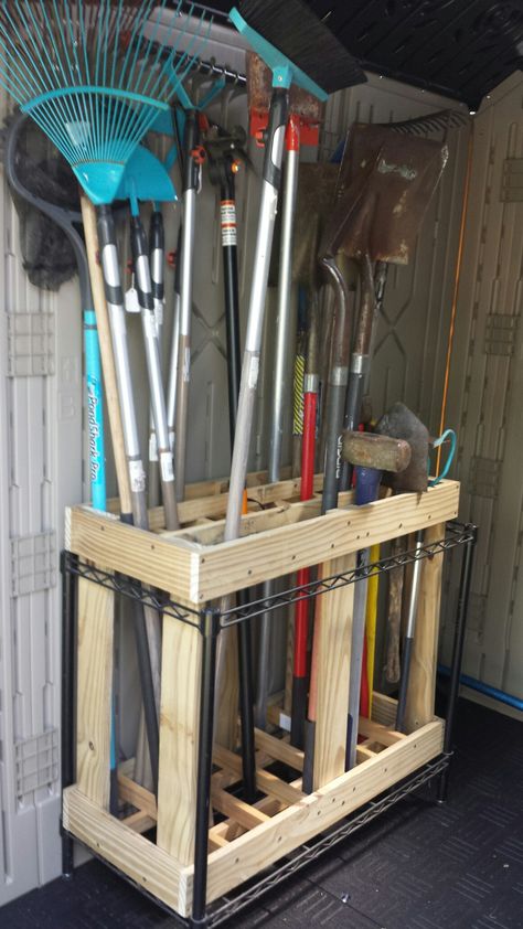 Storage for yard tools Storage For Yard Tools, Gardening Equipment Storage, Shovel Holder Tool Storage, Yard Tools Storage Ideas, Weedeater Storage Ideas, Shed Tool Storage Ideas, Yard Tool Organization, Mower Storage Ideas, Lawnmower Storage