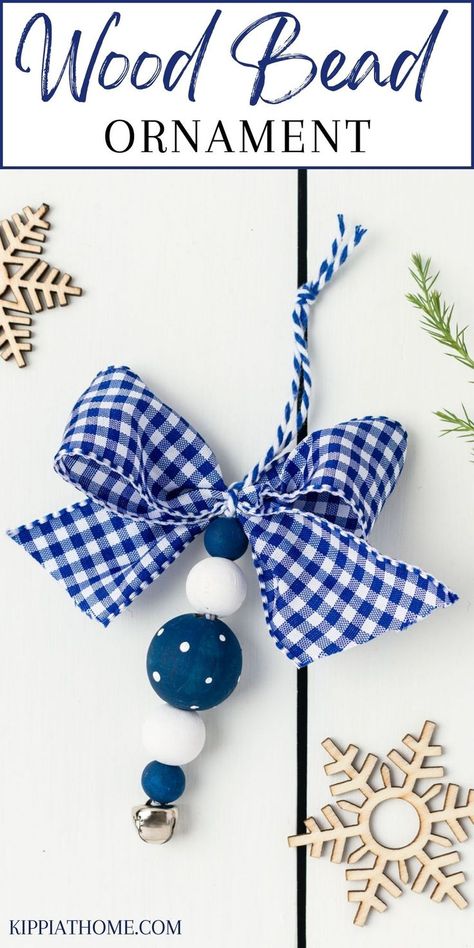 Blue and white wood bead ornaments on a white table Easy Beaded Christmas Ornaments, Wooden Bead Christmas Decorations, Wood Bead Projects Diy, Diy Wooden Bead Ornaments, Crafting With Beads, Blue Christmas Decor Diy, Wooden Bead Projects, Wood Bead Crafts Diy, Diy Christmas Ornaments Gifts