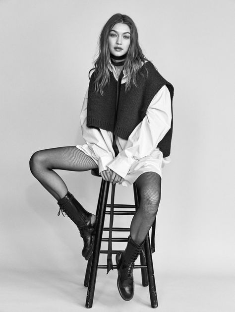 Gigi Hadid looks fashion forward in a layered ensemble Model Sitting Poses Stool, Styling Editorial Fashion, Mens Experimental Fashion, Vogue Studio Shoot, Simple Fashion Poses, Model Inspo Poses, Sitting Portrait Poses, Natural Model Poses, Fashion Model Poses Dress