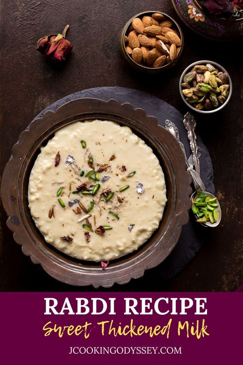 A bowl of Rabdi placed on a black slate next to serving spoon. Rabri Recipe, Rabdi Recipe, Hyderabadi Cuisine, Indian Milk, Peda Recipe, Indian Meal, Milk Dessert, Indian Dessert, Indian Sweet