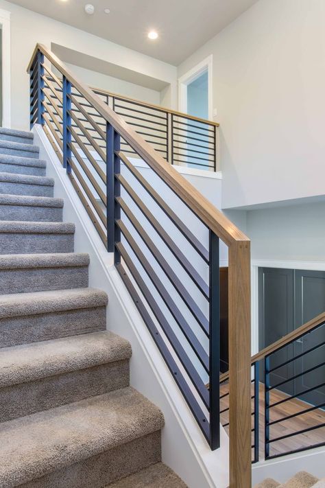 Unique, Stylish, Modern. The Denali Panel System in low sheen black has a unique design that will add a sleek & modern touch to any new home or remodel. • • Visit Brookfield Stairs and talk with our talented team of designers to help you create the look of your dreams! Brookfieldstairs.com • • #denalipanel #hardwoodhandrail #cleanandmodern #stairdesign #brookfieldstairs #powdercoating #lowsheenblack #moderncontemporary #unique #modern #stylish #stairs #architecture #staircase Upstairs Banister, Stylish Stairs, Staircase Redo, Architecture Staircase, Stairway Railing, Indoor Railing, Steel Railing Design, Stair Renovation, Modern Stair Railing