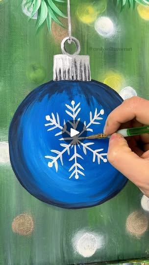 Christmas Ornament Painting Tutorial | Many of you are probably decorating your Christmas tree today so let's paint a fun snowflake ornament to celebrate! 🎨🎄
 #easypainting #tutorials... | By Emily Seilhamer Art | I bet many of you are
decorating your Christmas tree today so let's paint an
ornament to celebrate. I'm going to start with another
simple up and down background using dark green and light
green to start. I want it to look like the background is
like a Christmas tree but faded. Even mix in a couple
little pieces of dark green. You can do whatever colors you
want. I'm even going to take a little bit of dark navy blue
and white and put that in there as well to make it feel cold.
Maybe it's an outdoor Christmas tree. Remember, you can do
whatever color combination you want though. Acrylic Painting Christmas Easy, Easy Painting Ideas On Canvas For Beginners Christmas, Snowflake Painting Easy, Diy Canvas Art Easy Simple, Ornament Painting Ideas Easy, Christmas Paintings On Canvas Easy Diy, Christmas Painting Tutorial, Christmas Canvas Art Easy, Christmas Ornament Painting