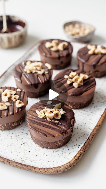 Holly Dyson | Healthy Recipes on Instagram: "Mini Chocolate Hazelnut Cheesecakes🍫🌰

These are honestly absolutely heaven! My absolute favourite combo is hazelnut and chocolate (let’s talk about that childhood Nutella addiction😉), and these will hit that spot. But made with wholesome ingredients of course🙌🏼☺️

RECIPE

VG | GF | RSF 

Ingredients
Base;
1 cup roasted hazelnuts
1 cup pitted medjool dates
2 tbsp @soma.cacao 
1/4 tsp sea salt

Filling;
1 cup cashews, soaked
1/3 cup @soma.cacao 
1/2 cup maple syrup
1/4 cup melted coconut oil
1 tsp vanilla
1-3 tbsp coconut milk

100g dark chocolate, to drizzle on top

Directions
Add the hazelnuts, dates, cacao and salt to a food processor and pulse until the mixture starts to stick together, and can hold together between your fingers.
Add a h Dates Recipes, Low Fat Vegan Recipes, Roasted Hazelnuts, Healthy Bars, How To Roast Hazelnuts, Medjool Dates, Quick Desserts, Vegan Sweets, Chocolate Hazelnut