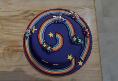 Mariokart rainbow road cake Diy Rainbow Road Mario, Mario Kart Rainbow Road Diy, Rainbow Road Cake, Mario Rainbow Road Cake, Mario Rainbow Road, Mariokart Rainbow Road Cake, Mario Kart Rainbow Road, Road Cake, Rainbow Road