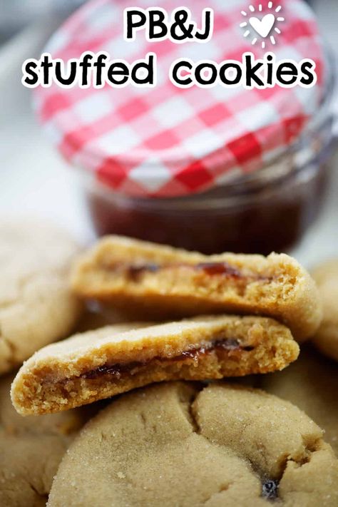 We stuffed as much peanut butter as possible into these thick, chewy peanut butter cookies - and then we filled the centers with strawberry jelly! Our Peanut Butter and Jelly Cookies look and taste like they came from a fancy bakery, but you can easily make them at home. Peanut Butter Jelly Recipes, Fancy Bakery, Peanut Butter And Jelly Cookies, Peanut Butter Jelly Cookies, Cookie Dough Ingredients, Jelly Cookies, Chewy Peanut Butter Cookies, Strawberry Jelly, Big Cookie