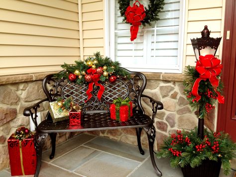 Outdoor Christmas Bench Decor, Decorate Bench For Christmas, Outdoor Bench Decorating Ideas Christmas, Christmas Front Porch With Bench, Christmas Bench Decorations Outdoor, Outdoor Bench Christmas Decorating Ideas, Decorating Outdoor Bench For Christmas, Christmas Porch Bench Decorating Ideas, Christmas Bench Decorating Ideas