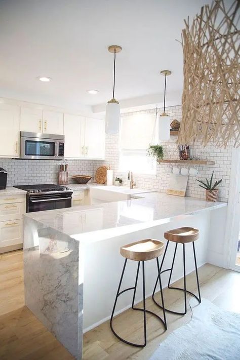 a refined U shaped kitchen with white cabinetry, white stone countertops, wooden stools, open shelves and pendant lamps Kitchen Design Small Space, Cabinet Remodel, Kitchen Cabinet Remodel, White Kitchen Design, Small Space Kitchen, 아파트 인테리어, Kitchen Plans, White Kitchen Cabinets, Kitchen Remodel Small