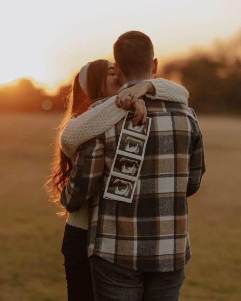 Capturing the warmth of a winter sunset as this beautiful couple announces their newest adventure. The glow of the setting sun and the joy in their eyes made this session unforgettable. #PregnancyAnnouncement #WinterMagic #SunsetLove #Expecting #WinterPhotography #CoupleGoals #BabyOnTheWay #GoldenHour #LoveInTheAir #karphotography Fall Baby Announcement, Fall Maternity Photos, Fall Couple, Fall Shoot, Fall Flannel, The Setting Sun, Fall Maternity, Winter Sunset, Fall Photoshoot