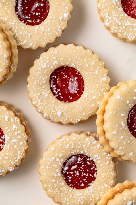 Strawberry Linzer Cookies are made with soft shortbread cookies sandwiched around sweet strawberry jam. They are great for Valentine’s Day, Mother’s Day, or Christmas. Shortbread Cookie With Jam, Easy Linzer Cookies, Lemon Linzer Cookies, Shortbread Cookies Aesthetic, Shortbread Jam Cookies, Sandwich Cookie Recipes, Strawberry Jam Cookies, Valentines Lunch, Raisin Filled Cookies