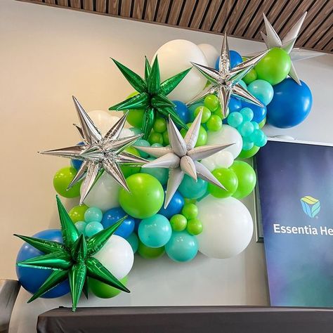 Lime Green And Blue Balloon Garland, Starburst Balloon Garland, Lime Green Balloon Garland, Grand Opening Balloon Ideas, Blue And Green Balloon Garland, Blue And Green Balloons, 90th Birthday Party Decorations, Teal Balloons, Corporate Christmas Parties