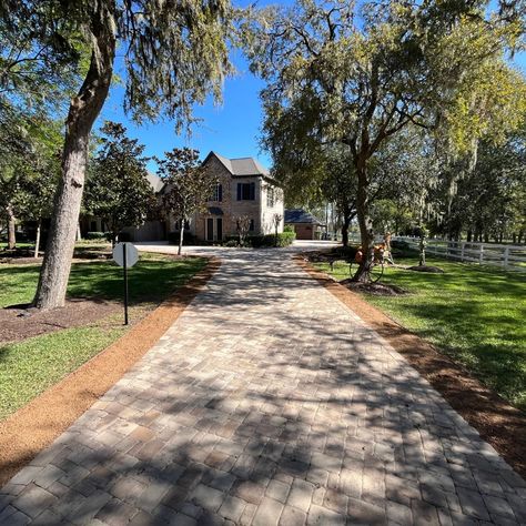 A grand entrance starts with a driveway that makes a statement. This stunning paver pathway leads to an already impressive home, setting the tone for a luxurious experience. What’s your dream entrance? #driveways #paverdesign Garden Setup, Paver Designs, Backyard Designs, Grand Entrance, Lush Garden, Backyard Design, Driveway, Fire Pit, Outdoor Space