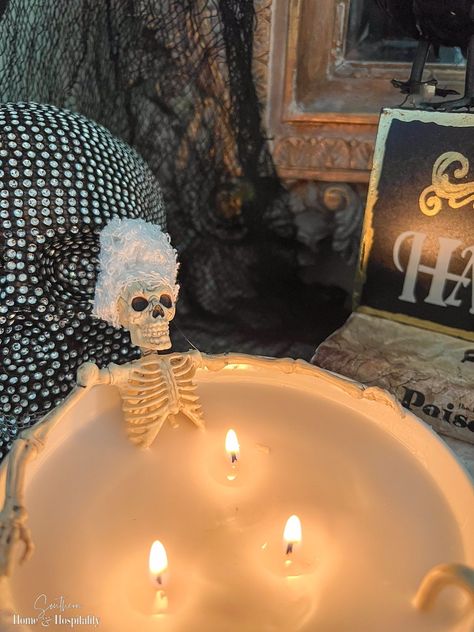 This DIY Halloween candle is a super inexpensive way to bring humor to your Halloween decorations with a bowl and candles from Dollar Tree and a two dollar WalMart skeleton! Skeleton Bathtub, Skeleton Decorations Outdoor, Candles Bathtub, Skeleton Poses, Outdoor Skeleton, Halloween Candles Diy, Hanging Centerpiece, Halloween Themed Food, Halloween Skeleton Decorations