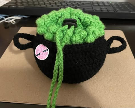 Shop my sale: 20% off. https://etsy.me/3Bw2nRF #etsy #tinydungeon #etsyfinds #etsygifts #etsysale #etsycoupon #shopsmall Just in time for Halloween! Make a lovely bubbling cauldron to store all of your dice! Crochet Cauldron Bag, Halloween Crochet Bag, Crochet Dice Bag Pattern Free, Crochet Dice Bag Pattern, Witchy Crochet Patterns Free, Witchy Crafts To Sell, Dnd Crochet, Dice Bag Pattern, Crochet Dice Bag