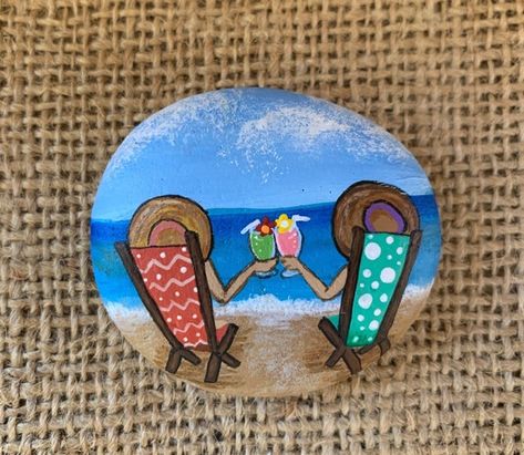 This is the Life! This handprinted rock is of 2 people enjoying life together on the beach. The back of the rock is painted white so you can add a personalized message if you want. Approximate Size: 2” x 2” Because Nature never creates identical rocks and all our rocks are individually painted River Stones Crafts, Beach Rock Art, Retirement Life, Flowers Painted, Painted Rocks Craft, Painted Rocks Diy, Painted Shells, Rock Painting Ideas Easy, Rock Painting Patterns