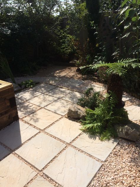 White concrete slab with onyx stone inlaid joints Granite Slabs Garden, Patio Slabs Ideas Natural Stones, Slab And Gravel Patio, Extend Concrete Slab Patio, Sandstone Paving Slabs, Patio Slabs, Gravel Garden, White Concrete, Concrete Slab