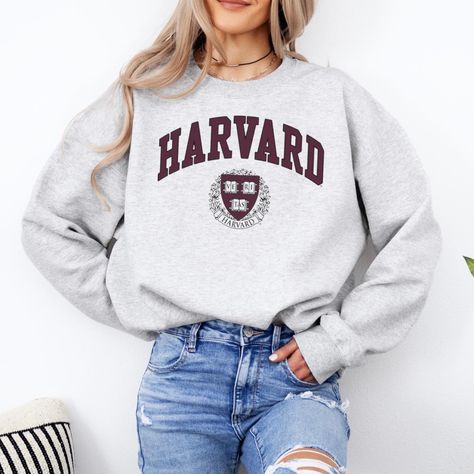 Harvard Unisex Sweatshirt / Harvard University Crewneck / Ivy League Sweatshirt / Harvard Gift / Harvard Law Merchandise Ideal for any situation, a unisex heavy blend crewneck sweatshirt is pure comfort. These garments are made from polyester and cotton. This combination helps designs come out looking fresh and beautiful. The collar is ribbed knit, so it retains its shape even after washing. There are no itchy side seams on these sweaters.  -Made with a medium-heavy fabric blend of 50% cotton an Harvard Shirt, Harvard Sweater, Boston Sweatshirt, University Sweater, Harvard Sweatshirt, College Sweater, University Crewneck, University Sweatshirts, College Sweatshirt