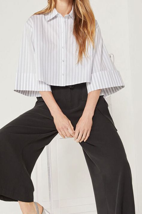 A professional stripe print adorns this unconventional cropped shirt! Runs big, please size down Spread collar 3/4 wide sleeves Front button closure Cropped hem Stripe print Material: 73% cotton, 23% polyester, 4% elastane Care: Machine wash cold. Do not bleach. Tumble dry low. Imported Shipping times: 2-5 business days Kick Flare Jeans, Cropped Shirt, Stripe Shirt, Destroyed Jeans, Plus Size Shopping, Wide Sleeves, Button Shirt, Crop Shirt, Shirt Sale