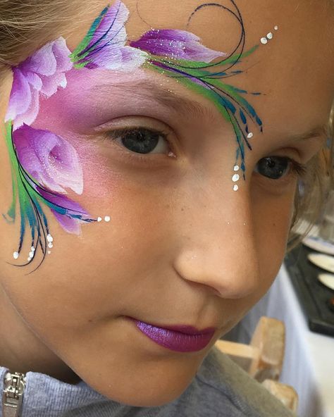 There is strength in gentleness #eyedesign #violet #purpleeyedesign #onestrokefacepainting #onestrokeflowers #faceart #facepainter… Spring Face Painting Ideas, Rapunzel Face Paint, Girls Face Painting Ideas, Fast Face Painting Designs, Flower Face Paint, Face Painting Flowers, Eye Face Painting, Fairy Face Paint, Animal Face Paintings