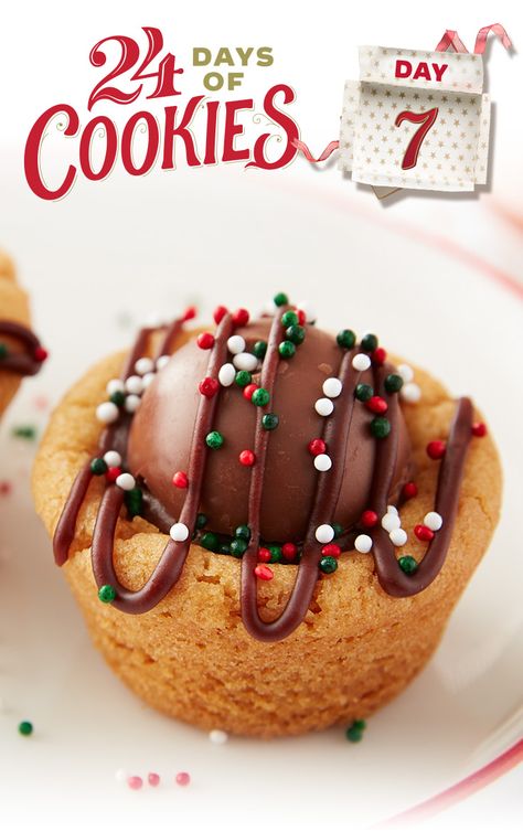 Looking for an indulgent treat for the holidays? Bake these delicious cookie cups that will wow your cookie exchange. This peanut butter cookie cup is stuffed with a layer of creamy frosting and topped with a milk chocolate Lindt truffle before being drizzled and decorated with icing and sprinkles. Try using a white or dark chocolate truffle for a different twist! Peanut Butter Cookie Cups, Lindt Truffles, Chocolate Lindt, Truffle Cookies, Creamy Frosting, Lindt Chocolate, Christmas Cookie Exchange, Peanut Butter Cookie, Chocolate Truffle